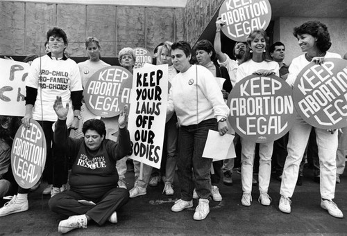 Operation Rescue demonstrator surrounded by pro-choice supporters